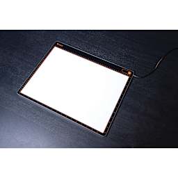 Daylight Tabla XL Light Pad, on table