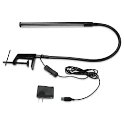 Studio Designs LED Bar Lamp - Black, laid out with USB cord extended next to AC adapter