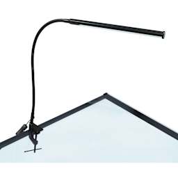 Studio Designs LED Bar Lamp - Black, attached to the top of a table