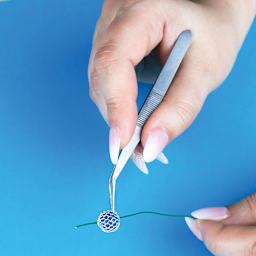 Excel Blades Curved Point Tweezers in use