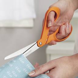 Fiskars Premier 8" Bent Scissors - Closeup of hands cutting fabric with scissors