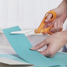 Fiskars Premier 8" Bent Scissors - Closeup of hands cutting paper with scissors