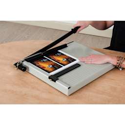 Dahle Paper Trimmer - 18" Cutting Length, one hand on base and one hand using string action blade