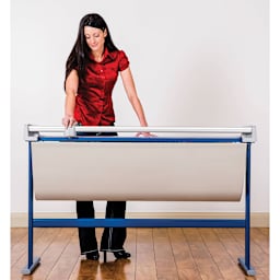 Dahle Large Format Premium Rotary Trimmer - 51" Cutting Length, adult in front of the trimmer