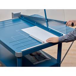 Dahle Large Format Premium Guillotine Trimmer - 43" Cutting Length, hand placing paper in trimmer
