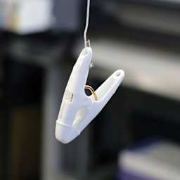 StikkiWorks Grid Ceiling Hanglers Clothes Pin Clamps, demonstration of the hanging clamp. 