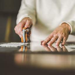 Fiskars Comfort Loop Rotary Cutter - Closeup of Rotary Cutter in use