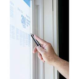 Olfa Metal Precision Utility Knife being used on window