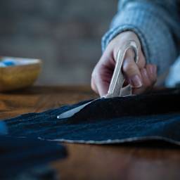 Fiskars Sparkle Scissors - Silver - in use to cut fabric