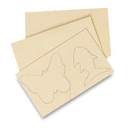 Miracle Sponges - Flat sponges shown with butterfly and fish traced on one for cutout