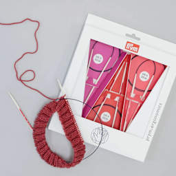 Prym Ergonomics Circular Knitting Needle Set (Demonstration of needle next to packaging)
