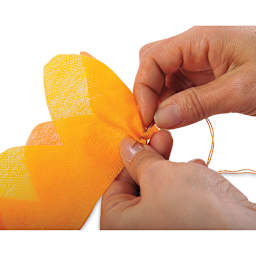 Smart-Fab Art and Decoration Fabric - Closeup of someone sewing fabric together as a flower 