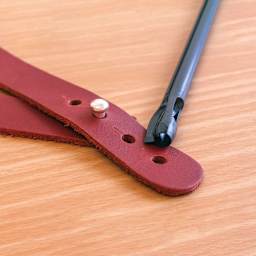 Leather Punch Tools - Closeup of Buttonhole Punch showing results on leather 