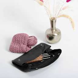 Muud Liv Leather Accessory Case - Black - on table (crochet hooks not included)