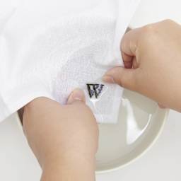 Rico Design Stick and Stitch Embroidery Kit - Pkg of 56, Colorful Floral Alphabet rinsing graphic in bowl of water