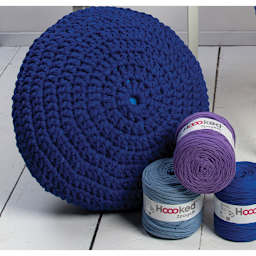 Hoooked Yarn Pouf Kit - Completed Pouf with other balls of yarn
