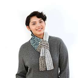 Lion Brand Mandala Ombre Yarn, person wearing a scarf made out of yarn