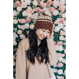 Lion Brand Basic Stitch Anti-Pilling Skein Tones Yarn (Person wearing multicolored knit hat)