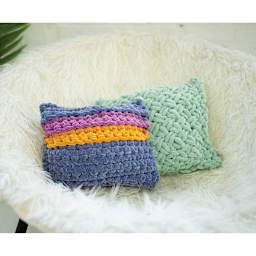 Lion Brand Vel-Luxe Jumbo Yarn (Two pillows on chair)