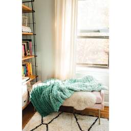 Lion Brand Off the Hook Ombré Yarn (Green blanket laying on chair)