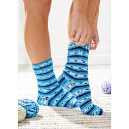 Premier Yarn Fruits Yarn - Blueberry (person putting on socks made with Blueberry yarn)