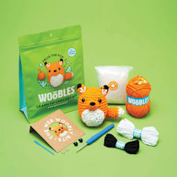 The Woobles Beginner Crochet Amigurumi Kit - Fox, contents and finished design laid out