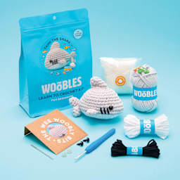 The Woobles Beginner Crochet Amigurumi Kit - Tank the Shark, kit contents with finished shark