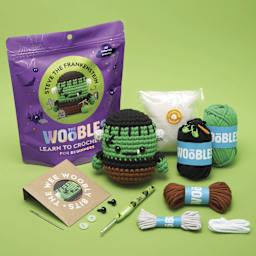 The Woobles Beginner Crochet Amigurumi Kit - Steve the Frankenstein - packaging, contents, and finished example