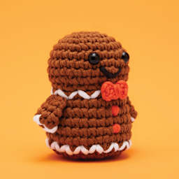 The Woobles Beginner Crochet Amigurumi Kit - Ted the Gingerbread Man, at an angle