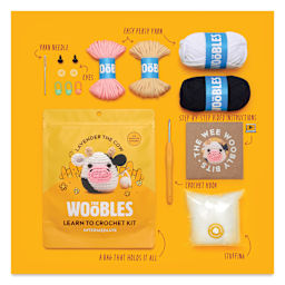 The Woobles Beginner Crochet Amigurumi Kit - Lavender the Cow, packaging and contents
