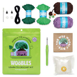 The Woobles Beginner Crochet Amigurumi Kit - Ophelia the Monstera contents with packaging