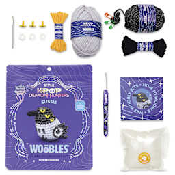 The Woobles Beginner Crochet Amigurumi Kit - Sussie the Magpie contents with packaging