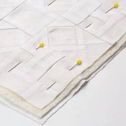 Dritz Quilting Pins, being used on fabric