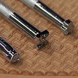 Realeather Geometric Stamp Set - Closeup of three handles with different stamps on each end
