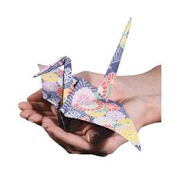 Roylco Really Big Origami Paper - Hands holding finished Origami Crane
