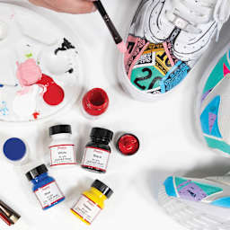 Angelus Acrylic Leather Paints, bottles laid out in front of hand painted shoes