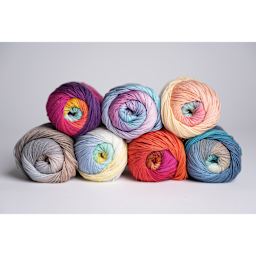 Lion Brand Mandala String Yarn - partial pyramid of seven skeins