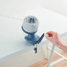 Clover Yarn Ball Winder - in use, with nearly full yarn spool