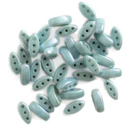 John Bead Czech Glass Cali Three-Hole Beads - Chalk and Green luster beads in loose pile