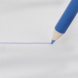Dritz Dressmaker's Marking Pencil - Light Blue close-up of marking on light fabric