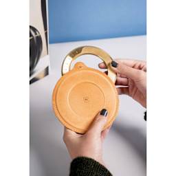 Makers Cabinet Leather Iris Sheath - 5" Diameter, held in hands (iris not included)