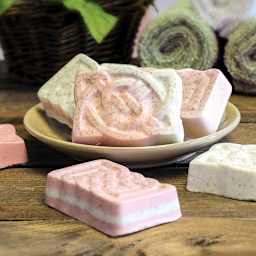 Life of the Party Botanical Soap Making Kit - Several finished soaps shown in and around dish