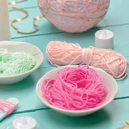 Craftivity Super String Lanterns - Yarn soaking in glue in preparation for assembly
