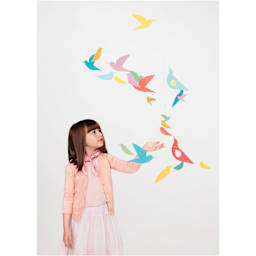 Djeco Little Big Room Giant Paper Mobile - Multicolor Birds (child standing next to mobile)
