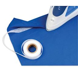 Singer Hemming Kit, close-up of iron-on tape being heat pressed