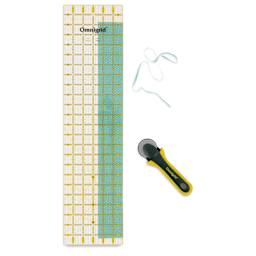 Omnigrid Rectangle Ruler - 6" x 24" - in use with fabric, cutter, and ruler (not included)