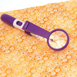Dritz Magnified LED Seam Ripper - in use on fabric