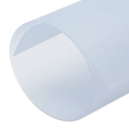 Dritz Heavy Duty Quilting Template - 12 in x 18 in - close-up of of end of rolled up sheet