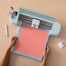 Cricut Everyday Iron-On Vinyl - Coral, single sheet fed through machine (not included)