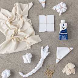 Rit Indigo Shibori Tie Dye Kit - Various materials shown with 1 Rit bottle ready for dyeing 